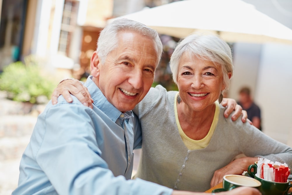 Couple smiling and enjoying a meal at one of the most romantic restaurants in St. Augustine