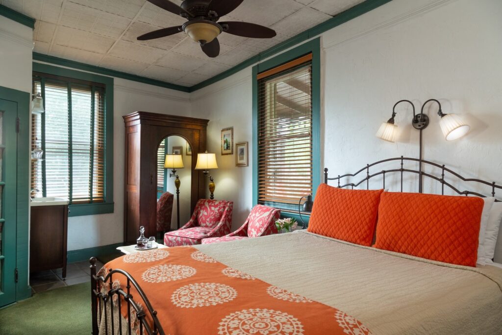 Enjoy a cozy guest room in the best Bed and Breakfast in St. Augustine, FL. Well appointed room with a large bed, ceiling fan, and armoire.
